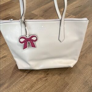 kate spade gray leather tote with pink bow charm pendant